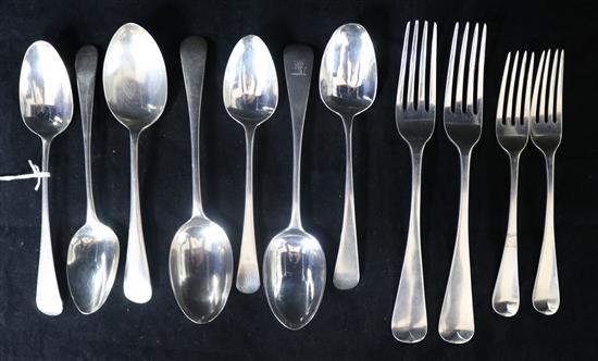 Seven assorted Georgian and later silver dessert spoons, two Georgian silver table forks and two Georgian silver dessert forks.